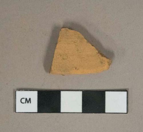 Unglazed redware vessel body fragment, likely terra cotta