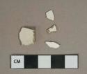 Undecorated whiteware vessel body fragments, white paste