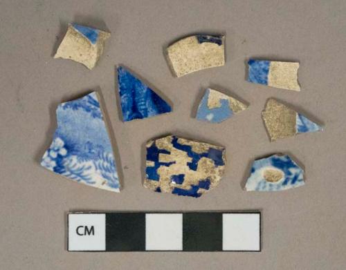 Blue on white transferprinted pearlware vessel body fragment, light buff paste