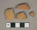 Unglazed undecorated redware vessel body fragments, likely terra cotta