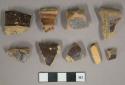 Brown saltglazed stoneware fragments, gray paste, visible temper, possible sewer pipe