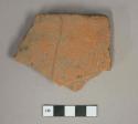 Red ceramic rooftile fragment, visible temper