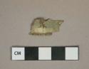 Metal alloy sheet fragment, corroded