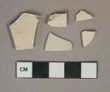 Undecorated light gray salt glazed stoneware vessel body fragments, gray paste