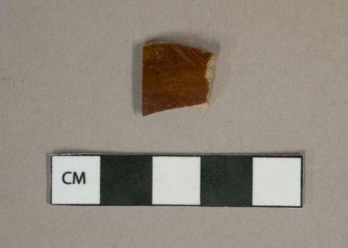 Brown mottled lead glazed earthenware vessel body fragment, buff paste, likely rockingham type