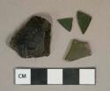 Olive green glass vessel fragments, weathered