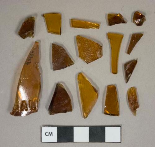 Amber glass vessel fragments, 3 with embossed decoration