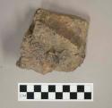 Likely stone tile fragments fused with slag, possible furnace lining