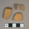 Unglazed redware vessel body and rim fragments, likely terracotta