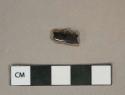 Black lead glazed redware vessel rim fragment, likely jackfield type