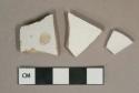 White undecorated ironstone vessel body fragments, white paste