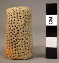 Ceramic sherd, leg of vessel or figurine, punctate design, notched, orange