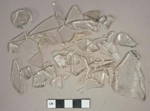 Colorless glass vessel fragments, 2 with embossed decoration