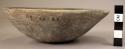 Ceramic bowl, brown, plain, flared sides, flat base, heavily reconstructed