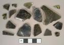 Dark olive green glass vessel body fragments, 1 fragment melted
