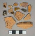 Brown lead glazed redware vessel body and rim fragments