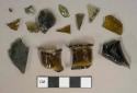 Olive green glass vessel fragments, 2 prescription finish fragments that cross-mend