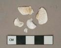 White unidentified shell fragments, degraded