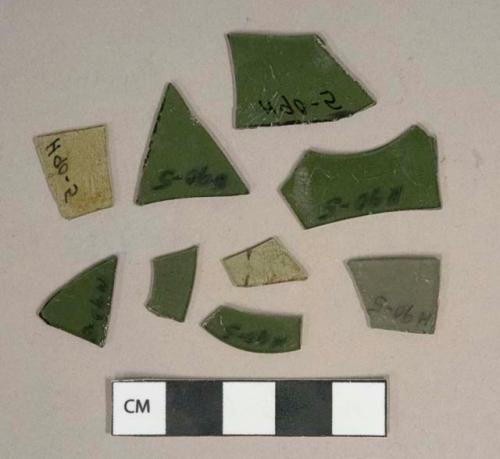 Dark olive green flat glass fragments