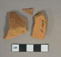 Undecorated unglazed redware vessel body fragments