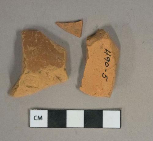 Undecorated unglazed redware vessel body fragments