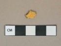 Yellow lead glazed earthenware vessel body fragment, buff paste