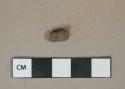 Metal alloy fragment, likely small caliber bullet casing, heavily corroded