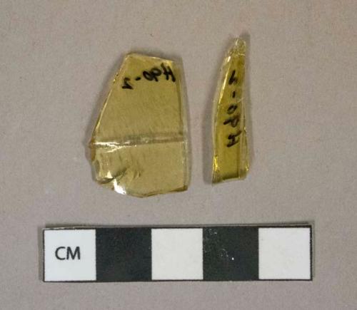 Yellow glass vessel fragments