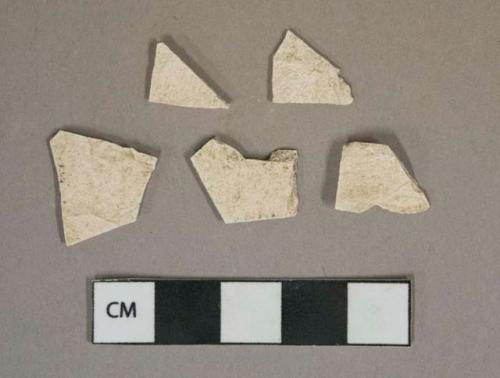 Undecorated whiteware vessel body fragments, glaze missing