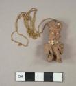 Pendant, kneeling figure