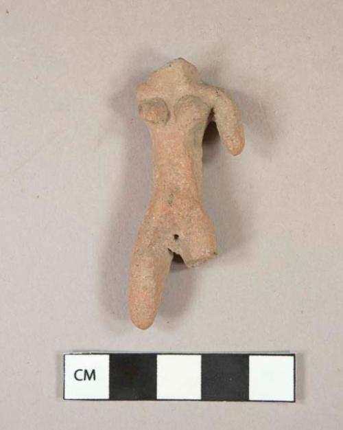 Pottery figurine-head missing