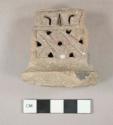 Large hollow rectangular incised and perforated pottery tripod foot