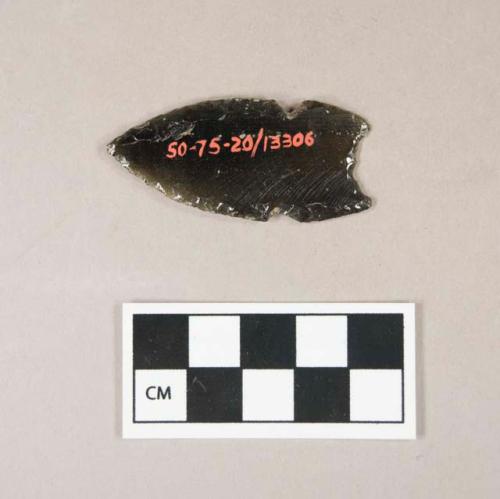 Chipped green obsidian point