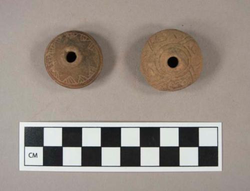 2 incised pottery spindle whorls