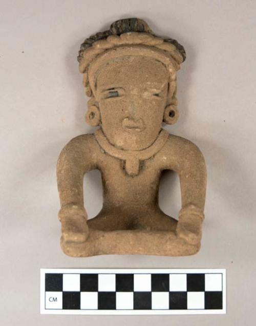 Seated pottery figure