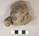 Head and one arm of figurine