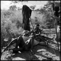 Two boys playing, with a girl sitting next to them watching, John Marshall filming them