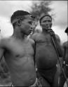 Ngani, close-up, and an unidentified man in the background, at a curing dance