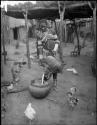 Makiena pouring milk from a calabash into a bowl