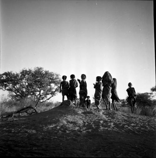 Children dancing on an ant hill