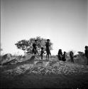 Children dancing on an anthill