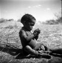 "Little /Gaishay" (son of Di!ai and "Gao Medicine") wearing rattles