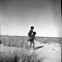 Two girls playing "piggy-back" near Gautscha Pan