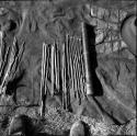 Quiver with contents laid out on a kaross, including arrow shafts without points, "male" and "female" fire-sticks, two drills, two long arrows with unbarbed points, an arrow-shaft, and six arrows with metal points
