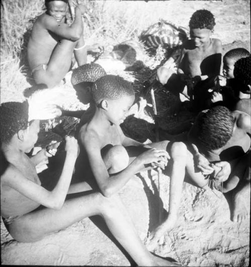 Group of boys making models from plasticene