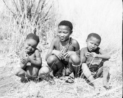 /Qui, !Ungka and Di//khao sitting (children of //Ao, ≠Toma's father's sister's son)