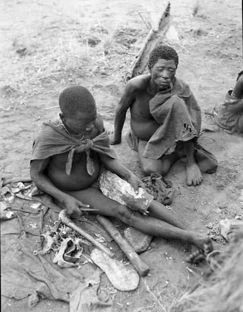 "Old Gau" (father of !Ungka and //Kushay) sitting with his brother, ≠Gao