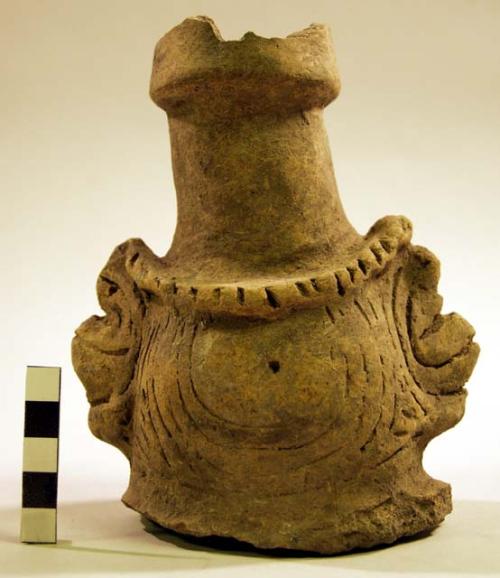 Cylindrical portion of a jar (neck?) with two zoomorphic lugs.