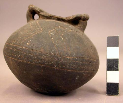 Pottery jar, with handles, incised ornament