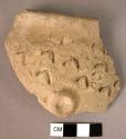 Rim potsherd with punched lug of finger marked barbotine ware